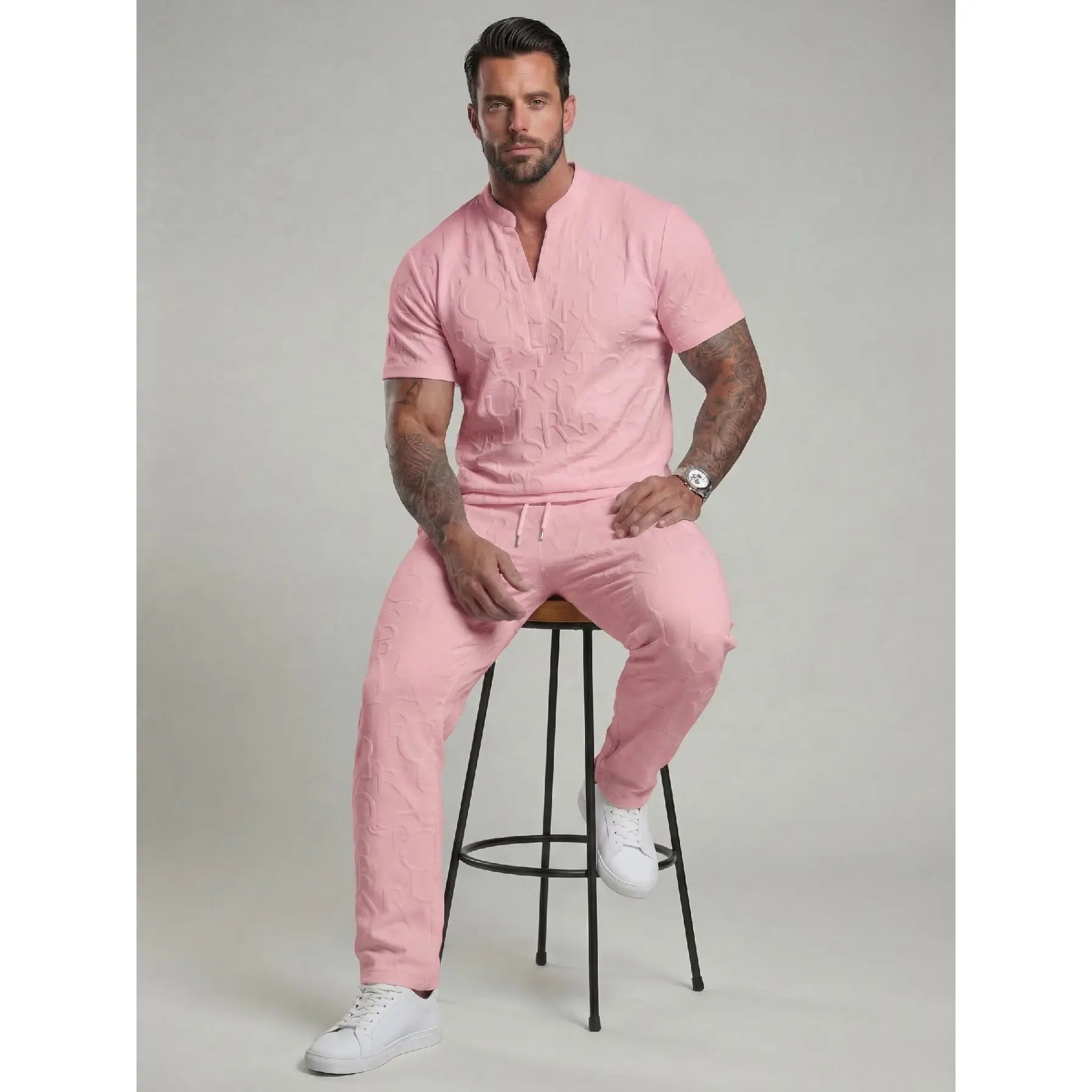 Pink men's textured short sleeve top and drawstring pants two-piece set